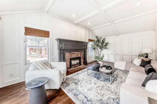 36 Stradbrooke Way Sw, Calgary, AB - Indoor Photo Showing Living Room With Fireplace