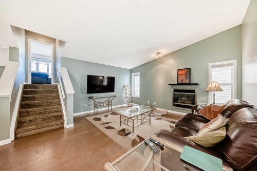 26 Copperfield View Se, Calgary, AB - Indoor Photo Showing Living Room With Fireplace