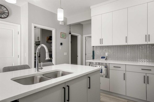 237 Walgrove Boulevard Se, Calgary, AB - Indoor Photo Showing Kitchen With Double Sink With Upgraded Kitchen