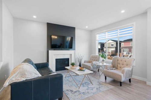 96 Emberside Glen, Cochrane, AB - Indoor Photo Showing Living Room With Fireplace