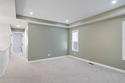 96 Emberside Glen, Cochrane, AB - Indoor Photo Showing Other Room