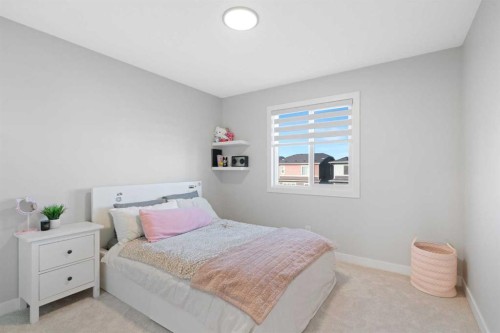 96 Emberside Glen, Cochrane, AB - Indoor Photo Showing Bedroom