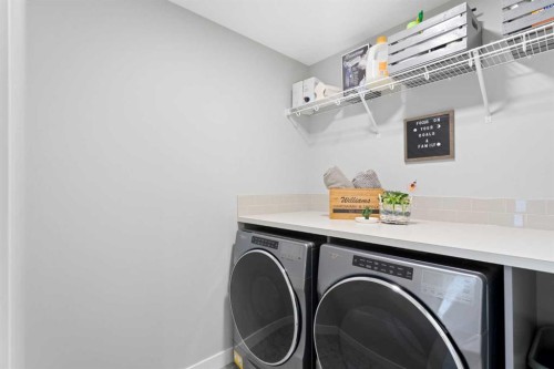 96 Emberside Glen, Cochrane, AB - Indoor Photo Showing Laundry Room