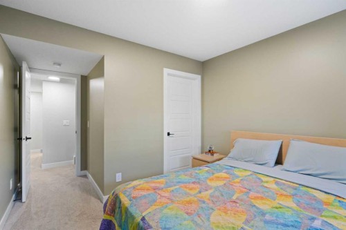 96 Emberside Glen, Cochrane, AB - Indoor Photo Showing Bedroom