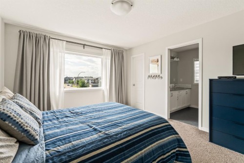 63 Seton Gardens Se, Calgary, AB - Indoor Photo Showing Bedroom