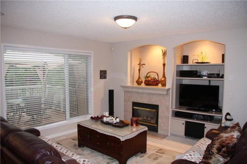 805 Panorama Hills Drive Nw, Calgary, AB - Indoor Photo Showing Living Room With Fireplace