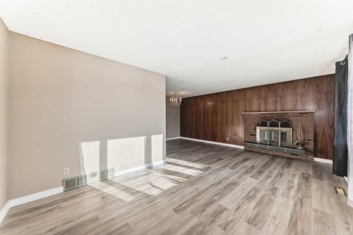 5439 Dalrymple Crescent Nw, Calgary, AB - Indoor Photo Showing Other Room With Fireplace