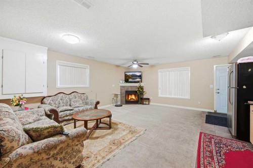 81 Saddlemont Road Ne, Calgary, AB - Indoor Photo Showing Living Room With Fireplace