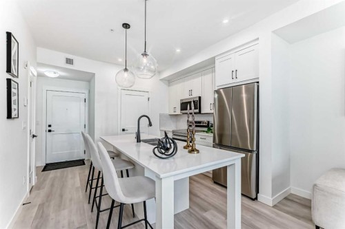 105-30 Sage Hill Walk Nw, Calgary, AB - Indoor Photo Showing Kitchen With Stainless Steel Kitchen With Upgraded Kitchen