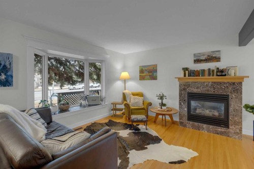 4512 41 Avenue Sw, Calgary, AB - Indoor Photo Showing Living Room With Fireplace