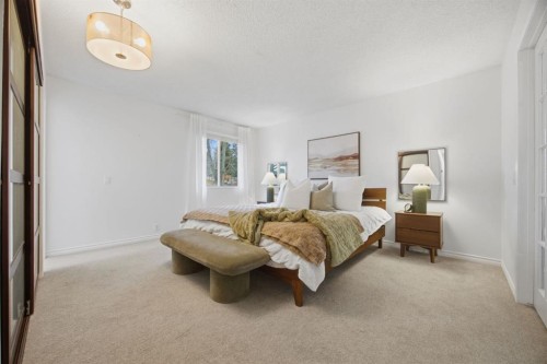 3 Stranraer Place Sw, Calgary, AB - Indoor Photo Showing Bedroom