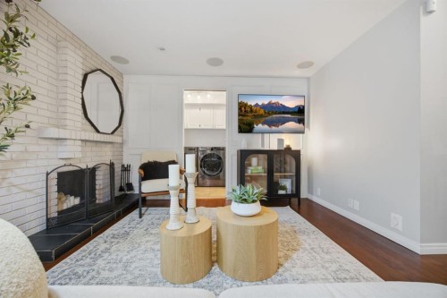 3 Stranraer Place Sw, Calgary, AB - Indoor Photo Showing Living Room With Fireplace