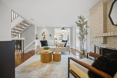 3 Stranraer Place Sw, Calgary, AB - Indoor Photo Showing Living Room With Fireplace