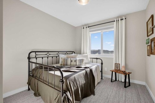 35 Wolf Hollow Park Se, Calgary, AB - Indoor Photo Showing Bedroom