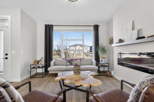 35 Wolf Hollow Park Se, Calgary, AB - Indoor Photo Showing Living Room With Fireplace