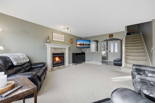 291 Springmere Link Sw, Chestermere, AB - Indoor With Fireplace