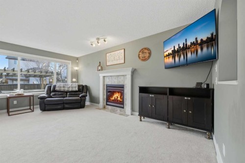 291 Springmere Link Sw, Chestermere, AB - Indoor With Fireplace