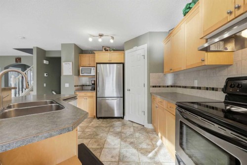 291 Springmere Link Sw, Chestermere, AB - Indoor Photo Showing Kitchen With Double Sink