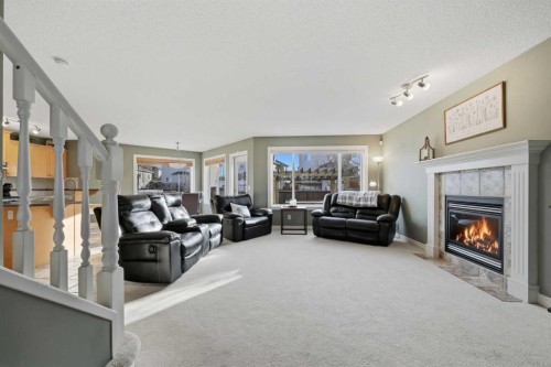291 Springmere Link Sw, Chestermere, AB - Indoor Photo Showing Living Room With Fireplace