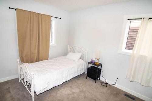 62 Walden Lane Se, Calgary, AB - Indoor Photo Showing Bedroom