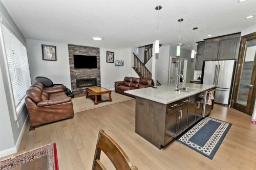 73 Redstone Link Ne, Calgary, AB - Indoor Photo Showing Kitchen With Fireplace With Stainless Steel Kitchen With Upgraded Kitchen