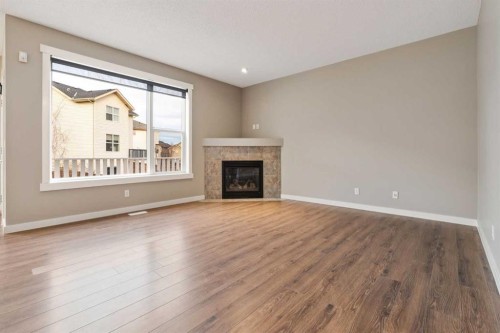 327 Panamount Point Nw, Calgary, AB - Indoor Photo Showing Living Room With Fireplace