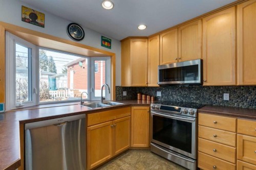 55 Heston Street Nw, Calgary, AB - Indoor Photo Showing Kitchen With Double Sink