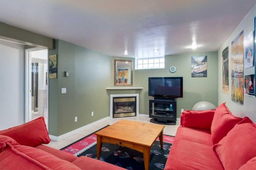 55 Heston Street Nw, Calgary, AB - Indoor Photo Showing Living Room With Fireplace