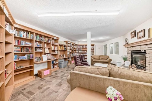 3129-6818 Pinecliff Grove Ne, Calgary, AB - Indoor With Fireplace