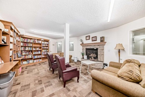 3129-6818 Pinecliff Grove Ne, Calgary, AB - Indoor Photo Showing Living Room With Fireplace