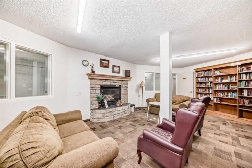 3129-6818 Pinecliff Grove Ne, Calgary, AB - Indoor Photo Showing Living Room With Fireplace