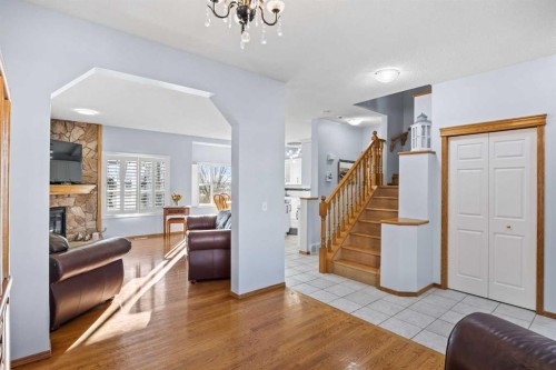 244 Oakmere Place, Chestermere, AB - Indoor Photo Showing Other Room With Fireplace