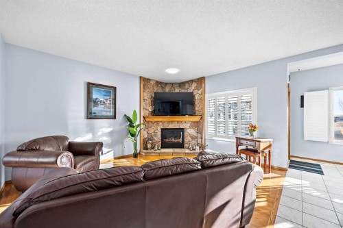 244 Oakmere Place, Chestermere, AB - Indoor Photo Showing Living Room With Fireplace