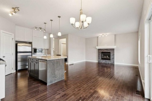 171 Kinniburgh Road, Chestermere, AB - Indoor With Fireplace
