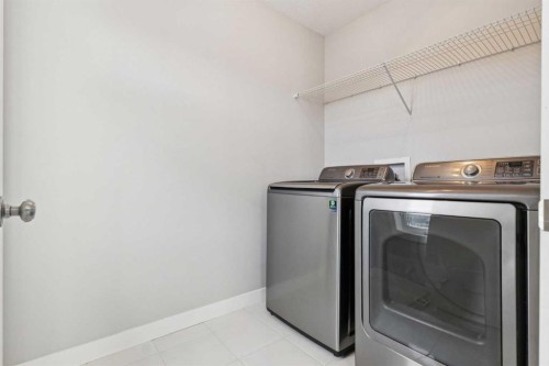 171 Kinniburgh Road, Chestermere, AB - Indoor Photo Showing Laundry Room