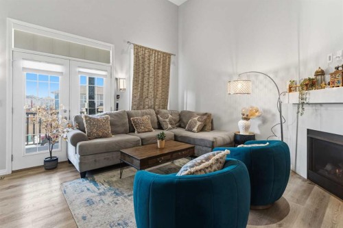 237 Windrow Crescent Sw, Airdrie, AB - Indoor Photo Showing Living Room With Fireplace