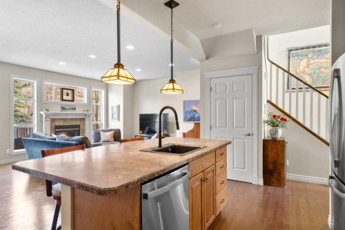 90 Discovery Ridge Gardens Sw, Calgary, AB - Indoor Photo Showing Kitchen With Fireplace With Upgraded Kitchen