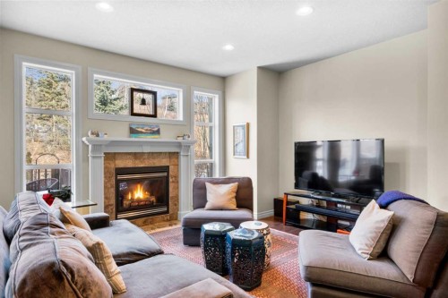 90 Discovery Ridge Gardens Sw, Calgary, AB - Indoor Photo Showing Living Room With Fireplace