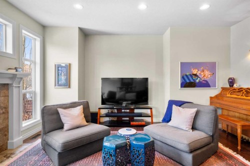 90 Discovery Ridge Gardens Sw, Calgary, AB - Indoor Photo Showing Living Room With Fireplace