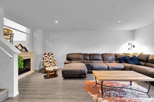 65 Sunset Heights, Cochrane, AB - Indoor With Fireplace