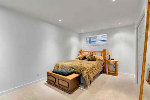 65 Sunset Heights, Cochrane, AB - Indoor Photo Showing Bedroom