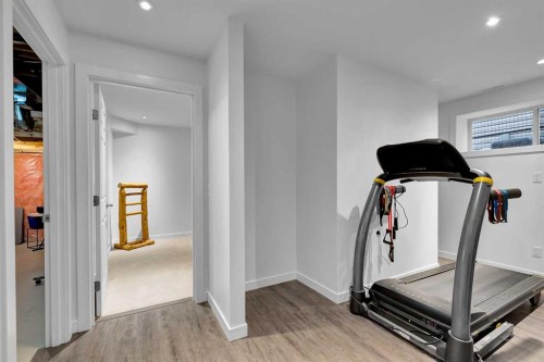 65 Sunset Heights, Cochrane, AB - Indoor Photo Showing Gym Room
