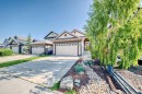 65 Sunset Heights, Cochrane, AB  - Outdoor With Facade 