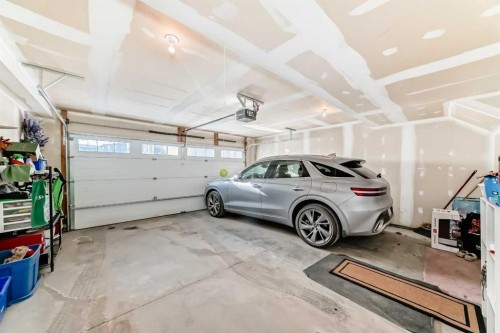 102-32 Horseshoe Crescent, Cochrane, AB - Indoor Photo Showing Garage