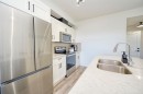 3409-200 Seton Circle Se, Calgary, AB  - Indoor Photo Showing Kitchen With Stainless Steel Kitchen With Double Sink 