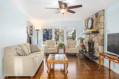 1315 Lake Michigan Crescent Se, Calgary, AB - Indoor Photo Showing Living Room With Fireplace