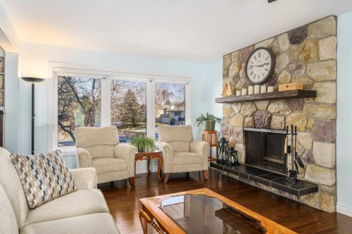 1315 Lake Michigan Crescent Se, Calgary, AB - Indoor Photo Showing Living Room With Fireplace