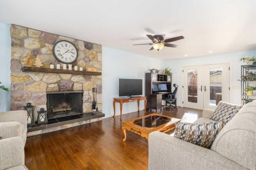 1315 Lake Michigan Crescent Se, Calgary, AB - Indoor Photo Showing Living Room With Fireplace