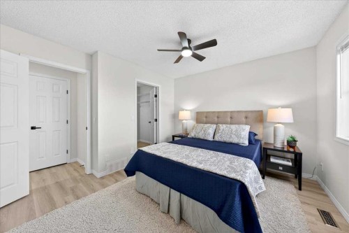 11 Copperfield Court Se, Calgary, AB - Indoor Photo Showing Bedroom