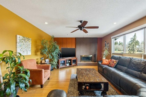 1507 Cayuga Drive Nw, Calgary, AB - Indoor Photo Showing Living Room With Fireplace